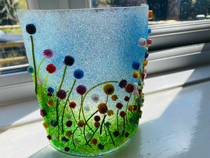 Handmade fused glass candle curve with 3d flower meadow detail 