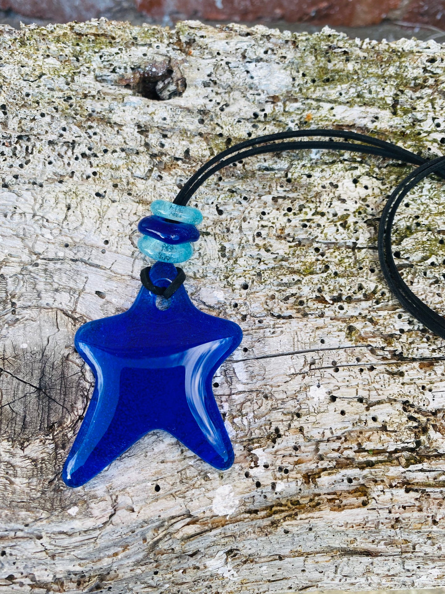 Handmade fused glass blue star pendant with bead detail  