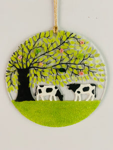 Handmade fused glass round with counrtyside and cow detail 