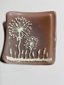 Handmade fused glass dusky pink dish with dandelion  detail 