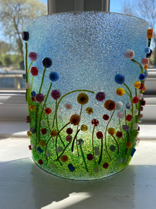 Handmade fused glass candle curve with 3d flower meadow detail 