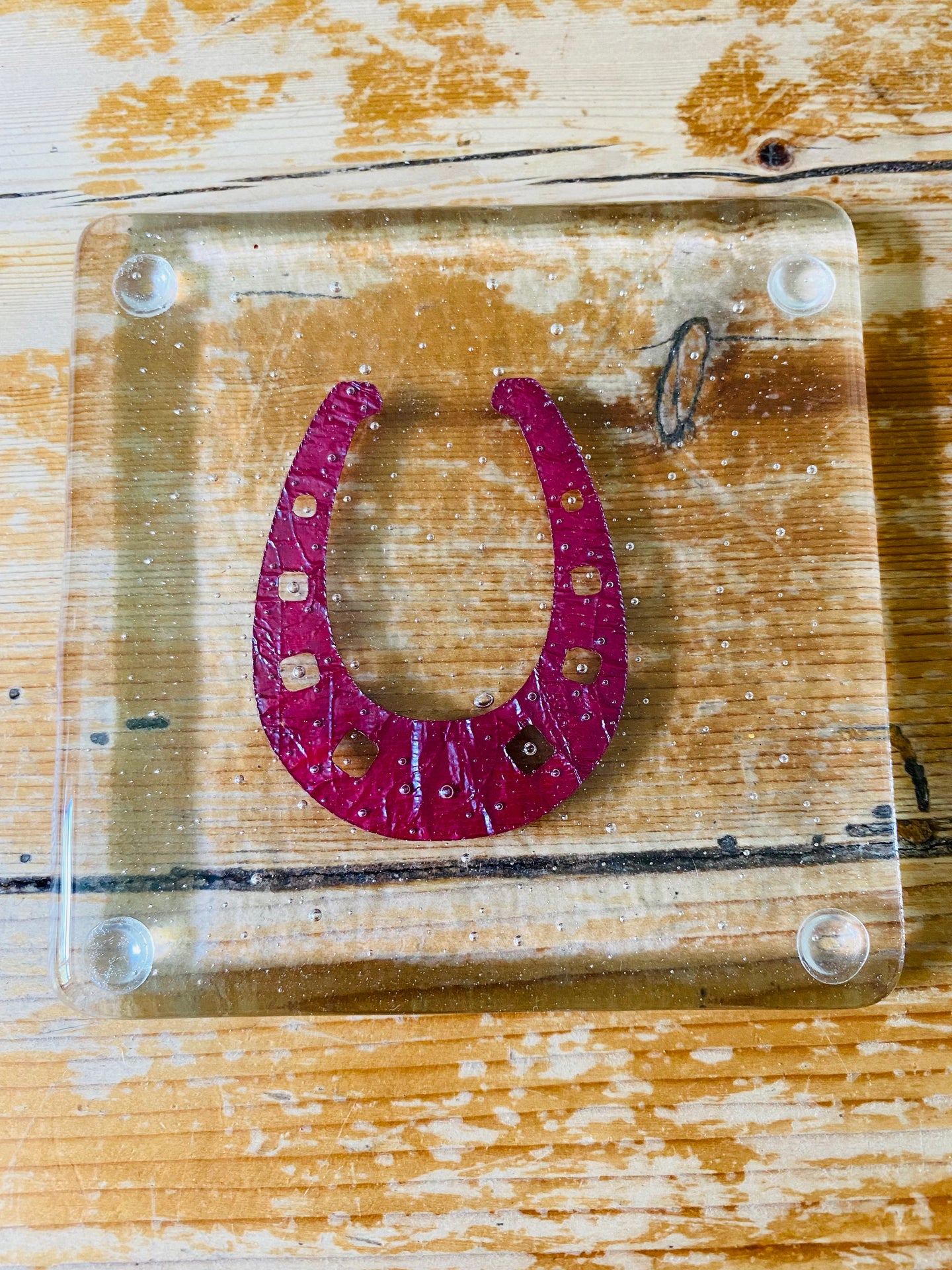 Handmade fused glass coaster with copper horseshoe inlay